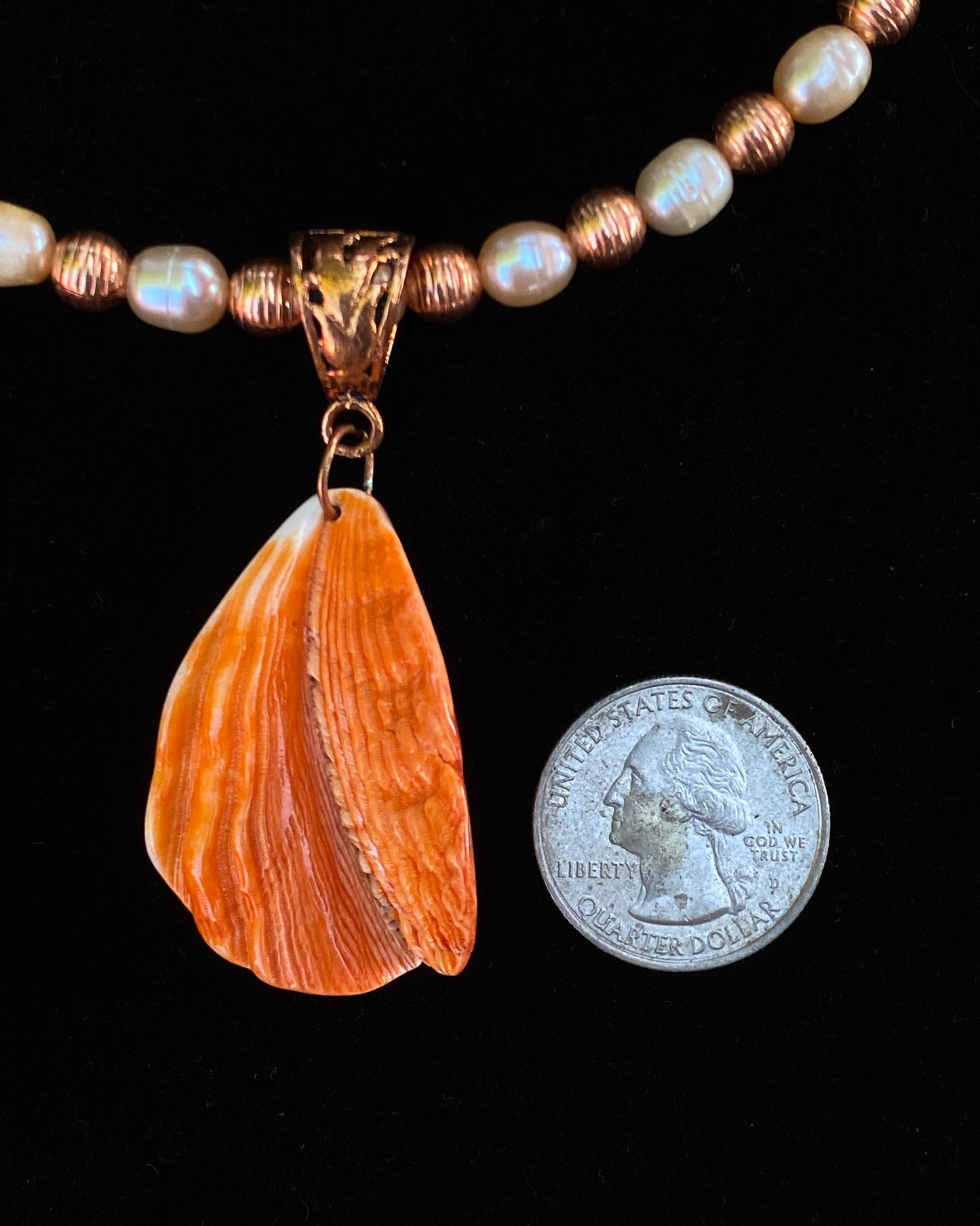 Shell Pendant on Pearl Necklace
