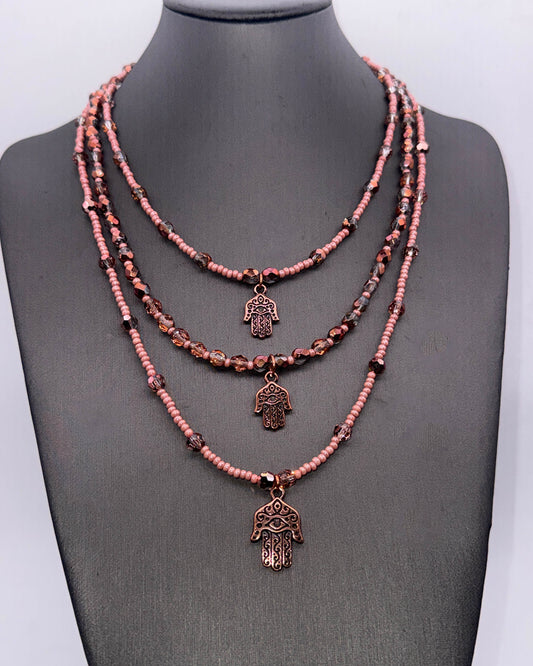 Layered Glass Beaded Necklace with copper Hamsa.