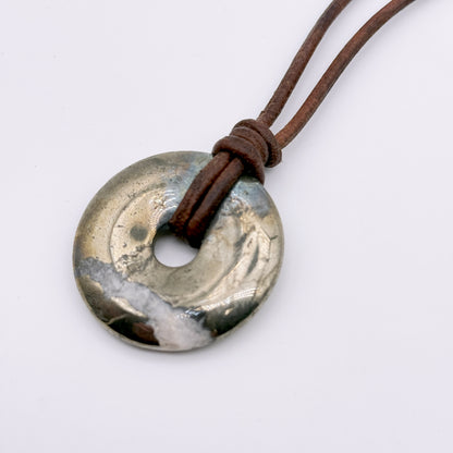 Pyrite donut necklace on leather