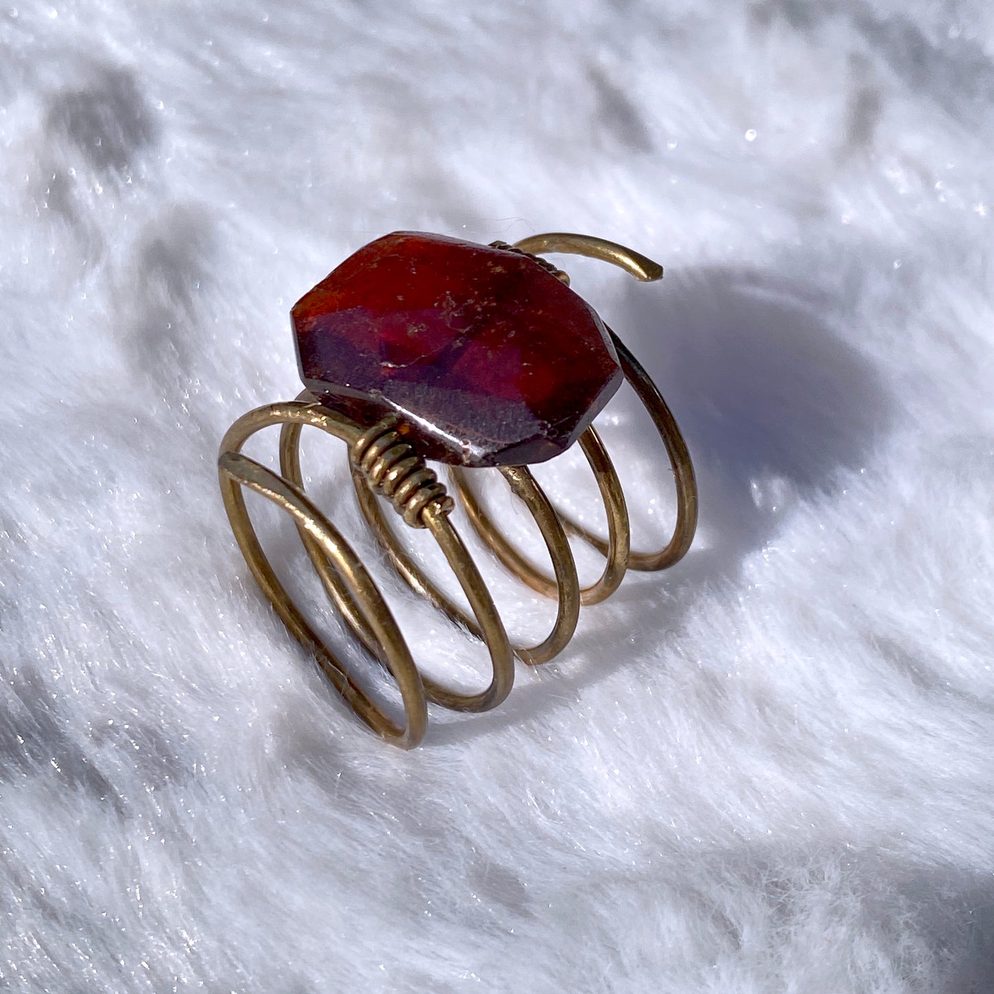 Hand hammered Brass wire ring with garnet birthstone