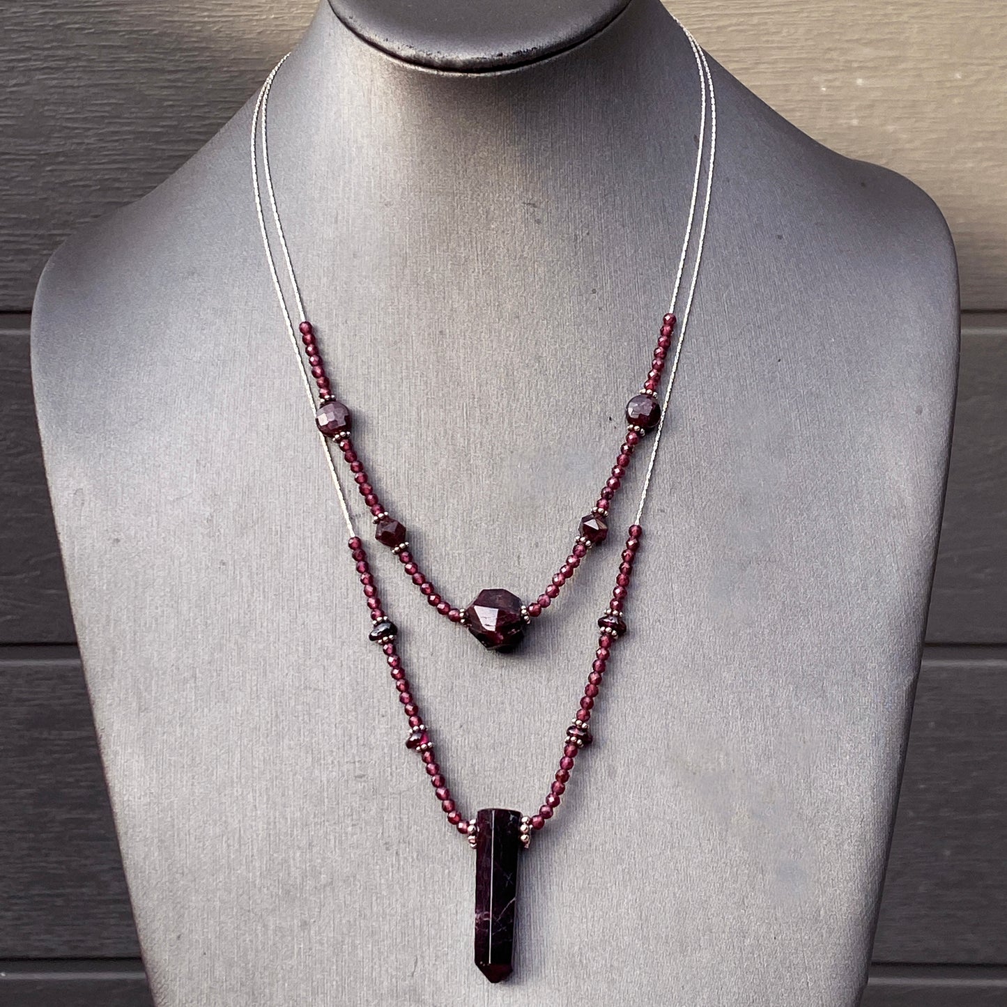 Garnet gemstones with sterling silver double strand necklace.