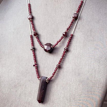Garnet gemstones with sterling silver double strand necklace.