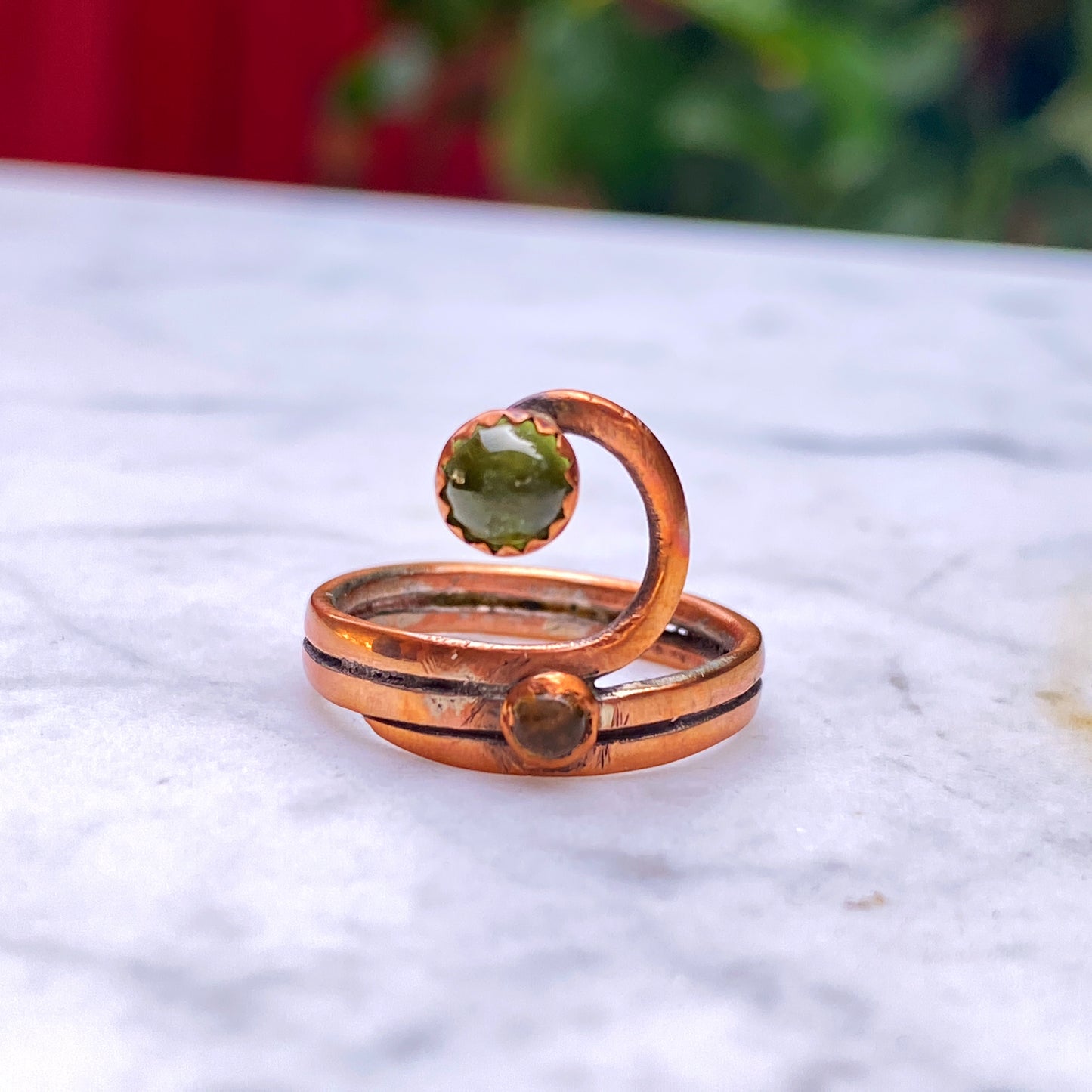 Handmade copper Ring with a Peridot gemstone.