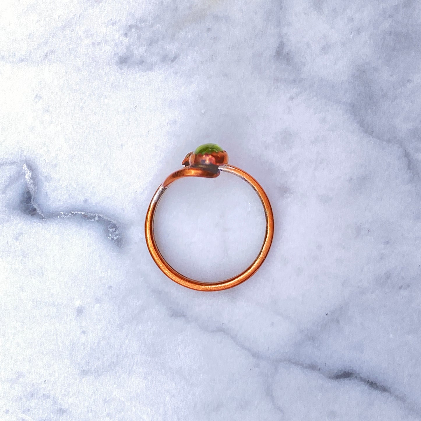 Handmade copper Ring with a Peridot gemstone.