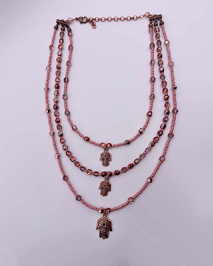 Layered Glass Beaded Necklace with copper Hamsa.