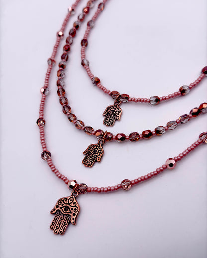Layered Glass Beaded Necklace with copper Hamsa.