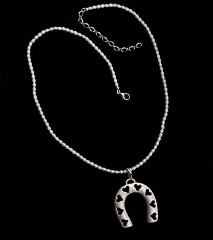 Pearl beaded necklace with silver plated Horseshoe pendant