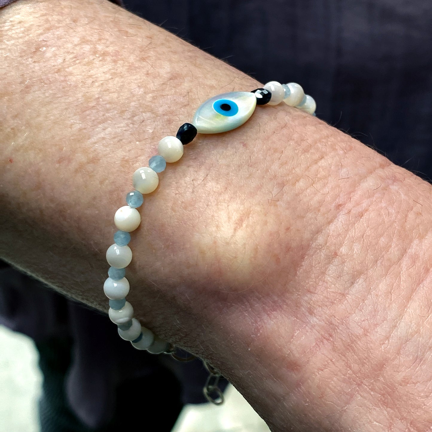 Women's mother of pearl, Blue Sapphire, and Aquamarine Evil Eye Gemstone silver Clasp Bracelet