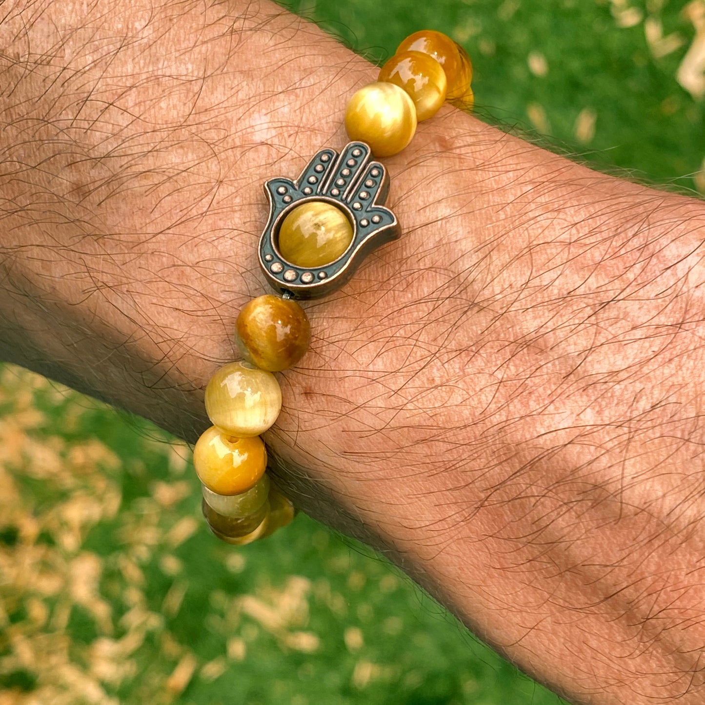 Men's Tiger Eye gemstone and copper Hamsa bracelet.