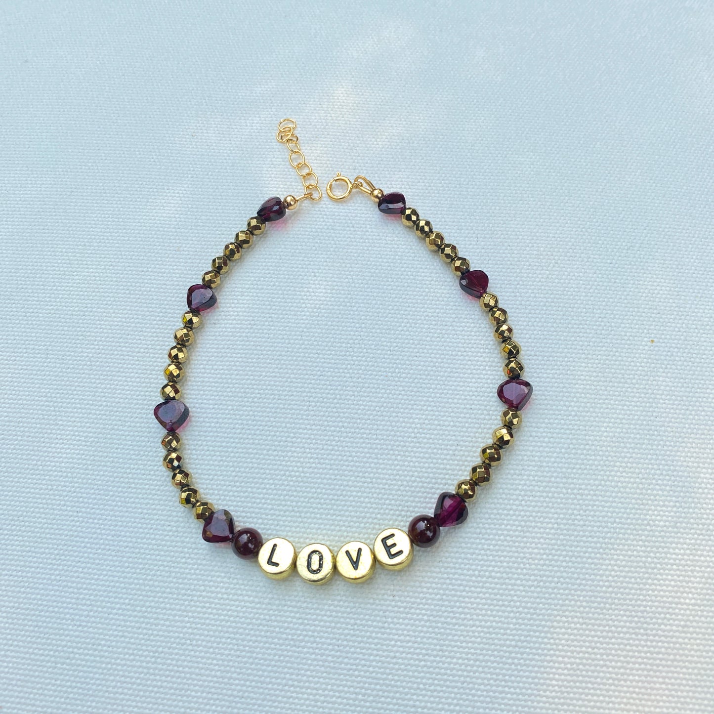 Garnet and hematite beaded gemstone “love” anklet with heart shaped garnets