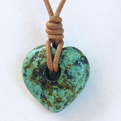 African Turquoise gemstone heart on natural leather with copper clasp