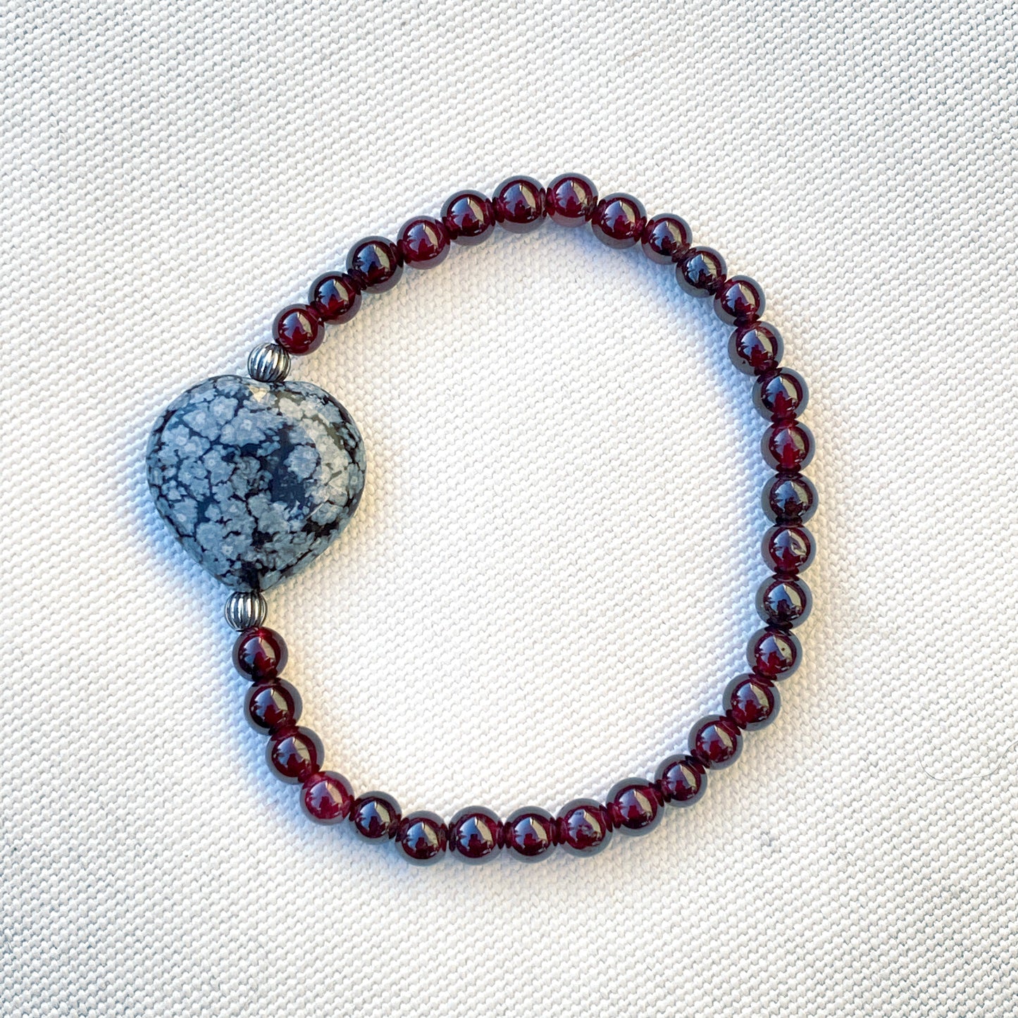 Garnet gemstones, Snowflake Obsidian Heart, and Sterling Silver Stretch Bracelet