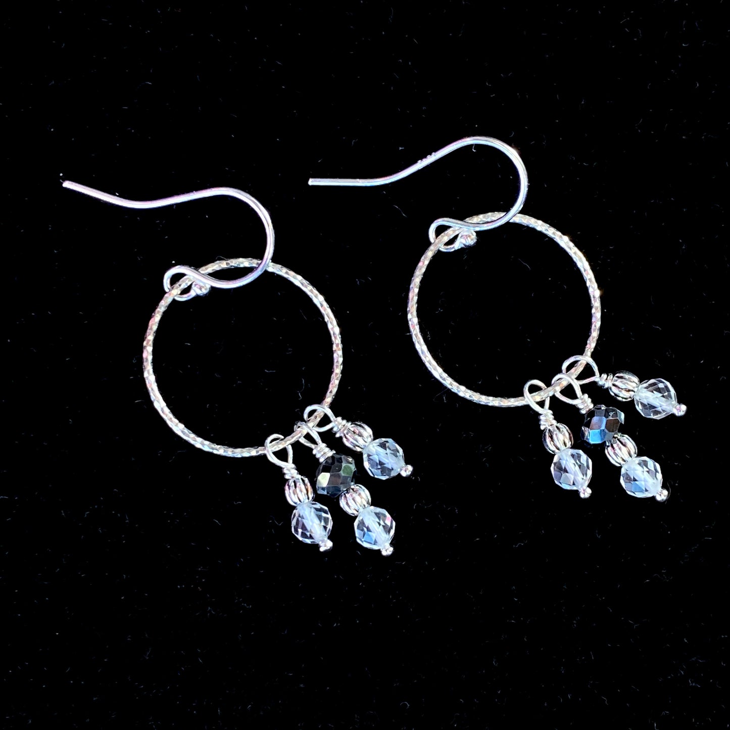 Black diamond, white topaz gemstones, and and sterling silver dangle earrings