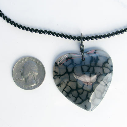 Hand Wrapped Dragon’s Vein Agate Heart on Onyx necklace with Oxidized Sterling Clasp