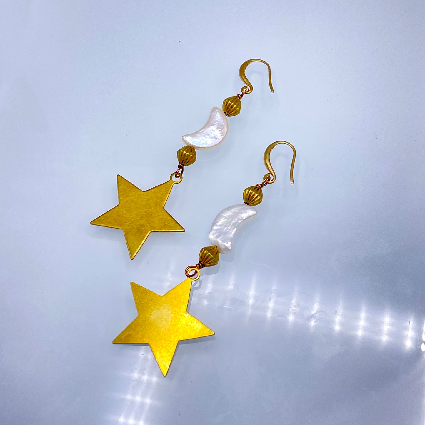 Pearl Moons and Brass Star Dangle Earringa