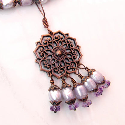 Purple freshwater pearls, amethyst gemstones, and copper chain and pendant design.