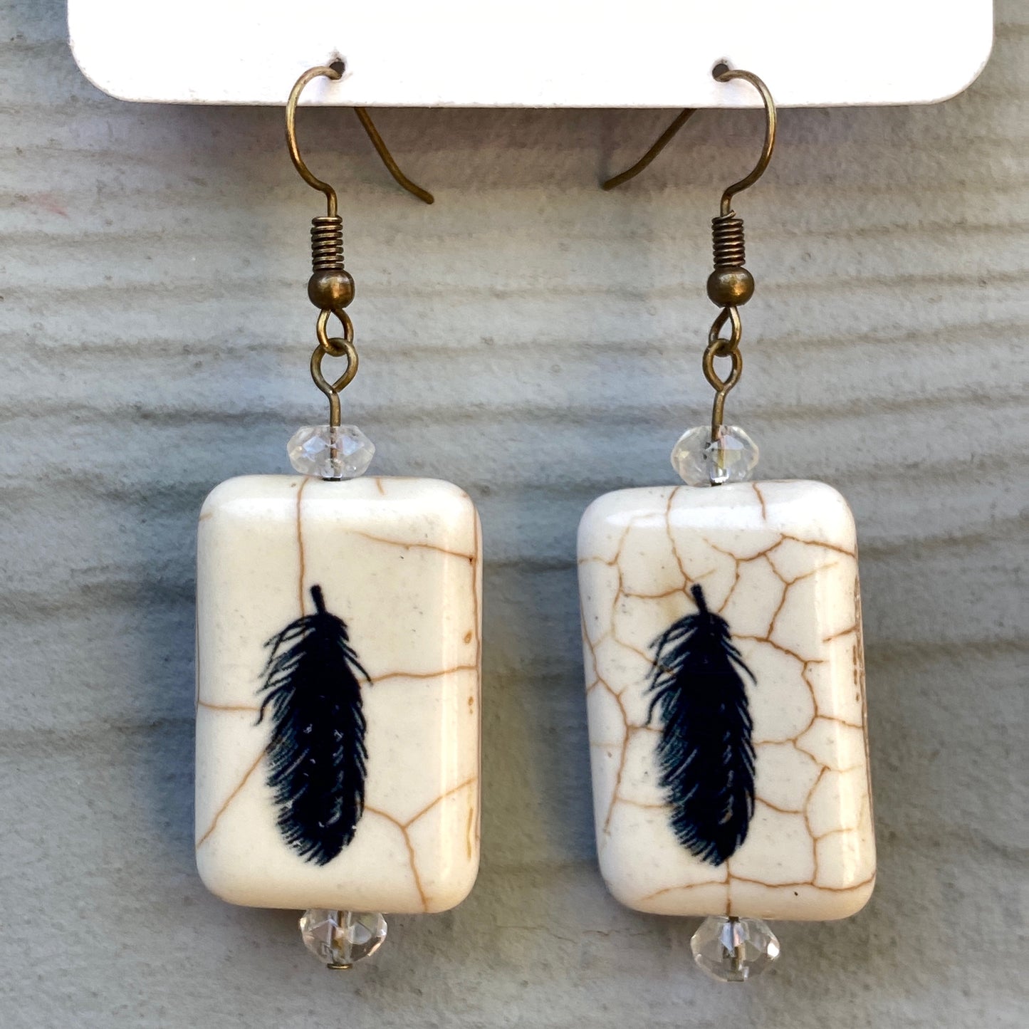 Painted Feather earrings with citrine gemstones.