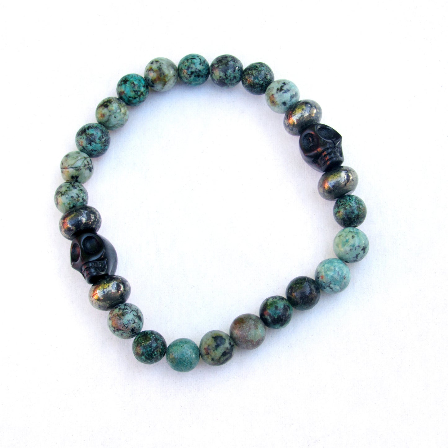 African Turquoise, Pyrite, and Howlite Skull Men’s Stretch Bracelet