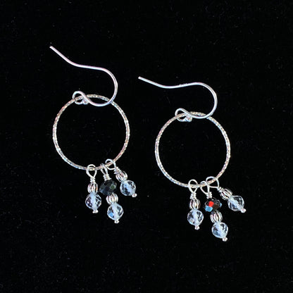 Black diamond, white topaz gemstones, and and sterling silver dangle earrings