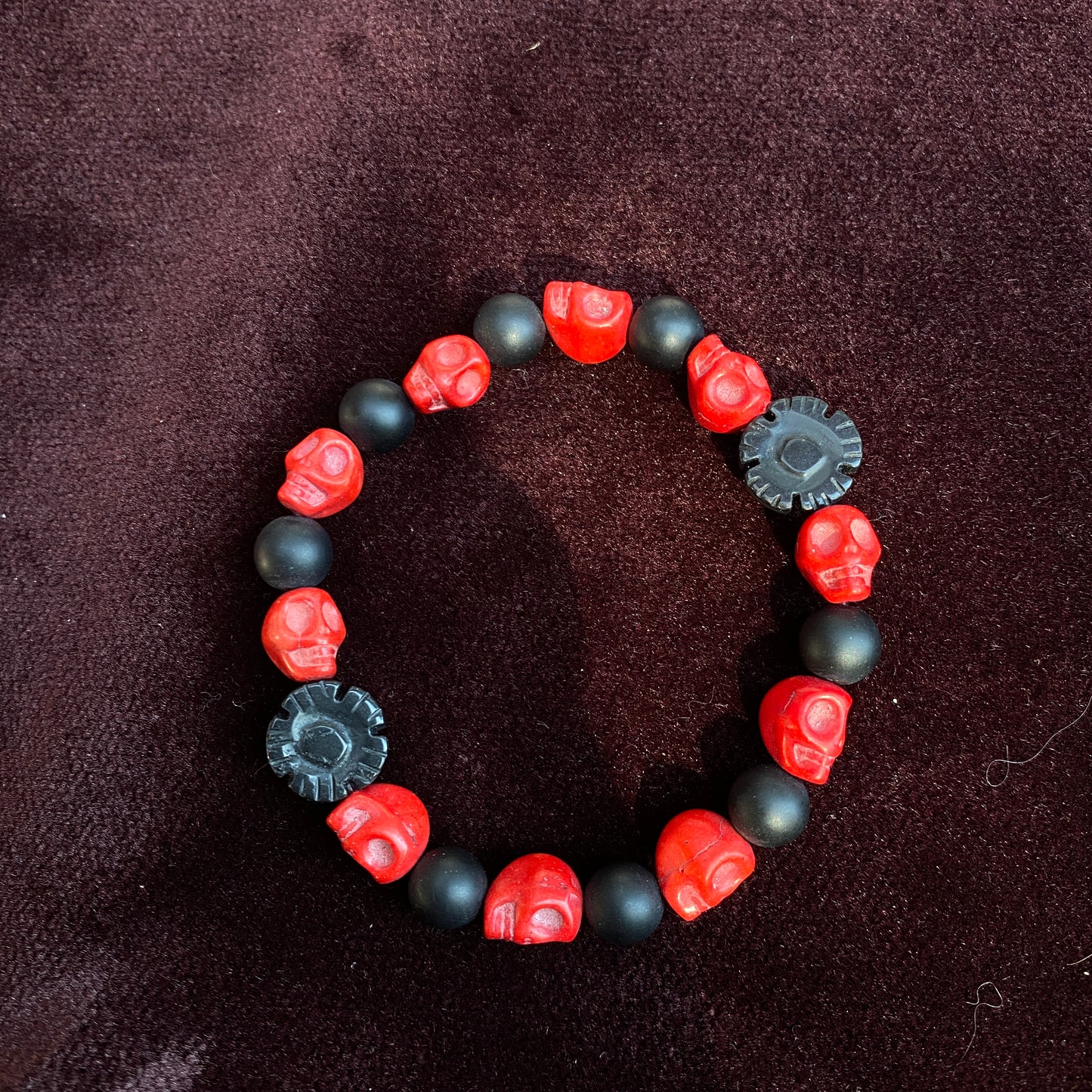 Red Skull carved howlite with matte Onyx Gemstone stretch bracelet
