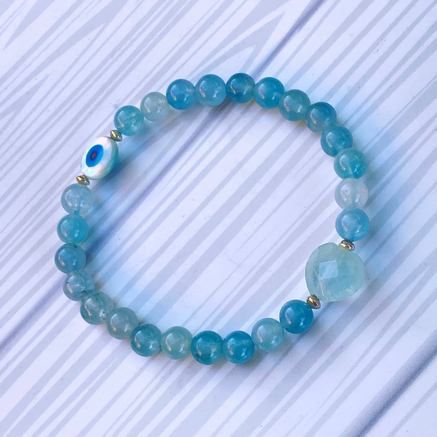 Aquamarine with Mother of Pearl Evil Eye stretch Bracelet