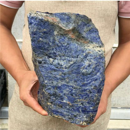 Natural sodalite gemstone rough rock with flat bottom for display