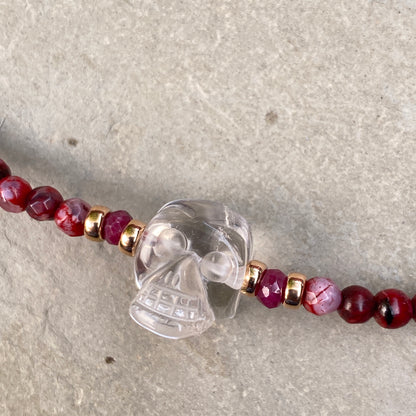 Clear quartz gemstone Skull with Rubies and fire agates and 14 kt rose gold