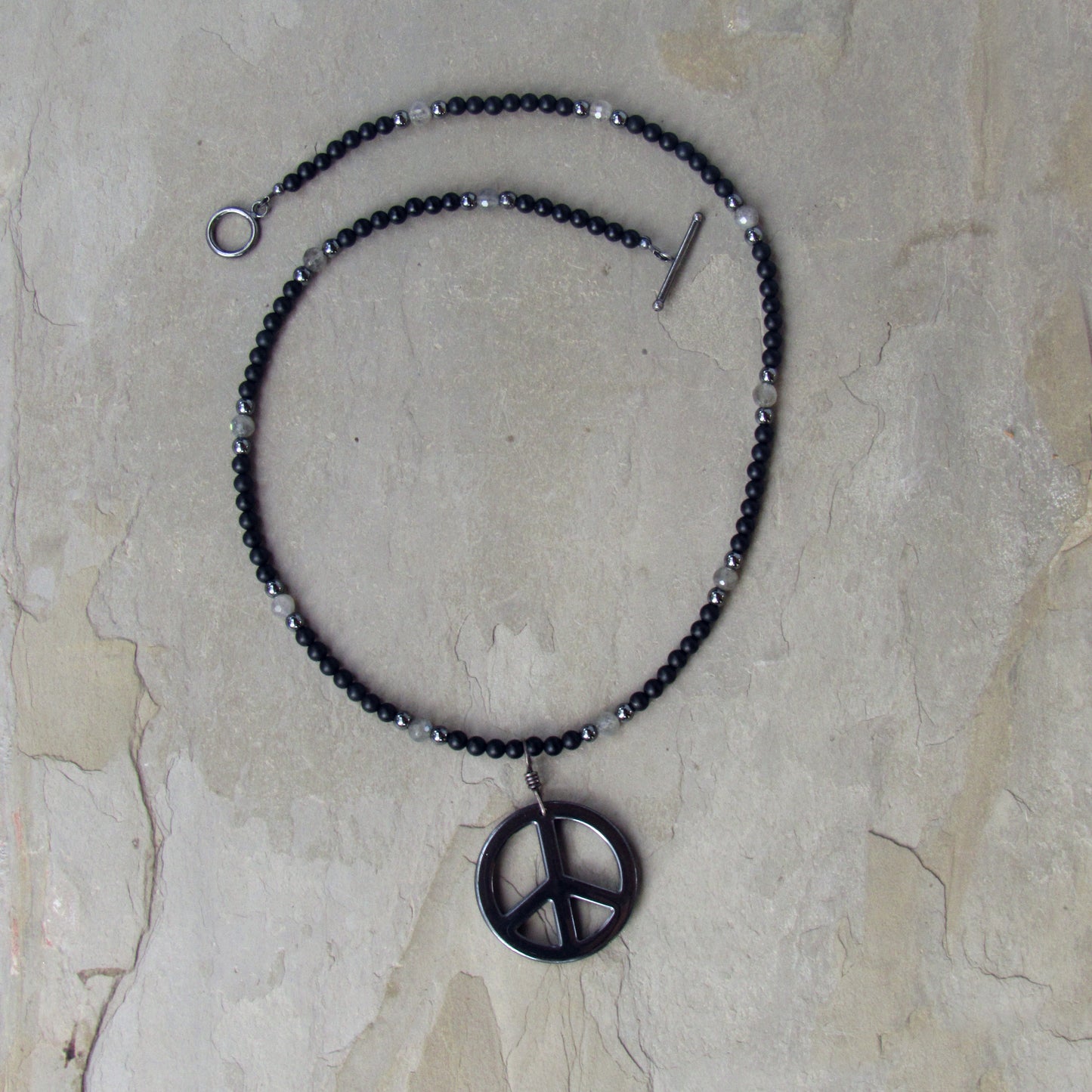 Hematite Peace Pendant, Hand Wrapped w/ Oxidized Sterling Silver, Matte Black Onyx, and Labradorite Men’s Necklace