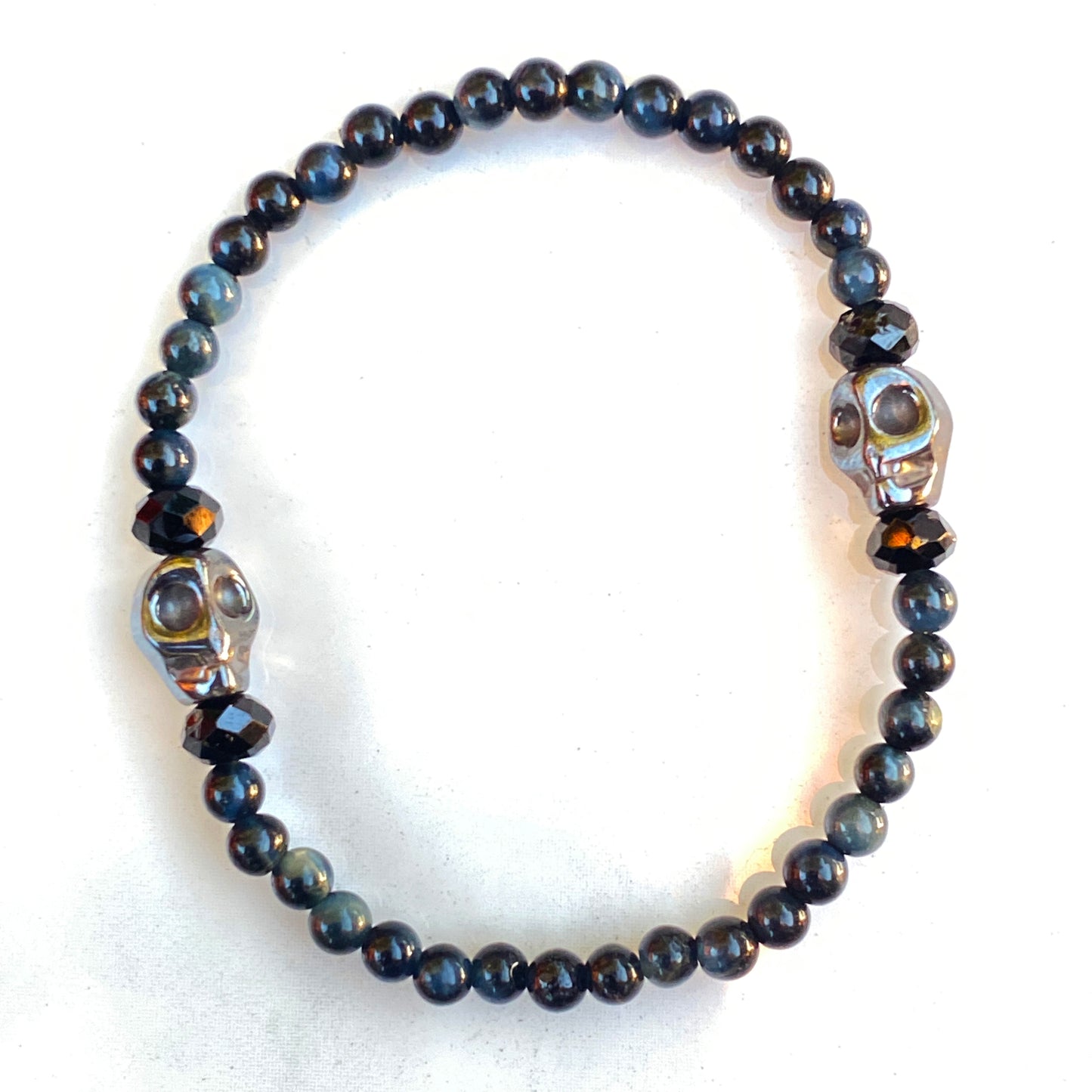 Blue Tiger Eye gemstones, Black Spinel, and Hematite Skull Women’s Stretch Bracelet