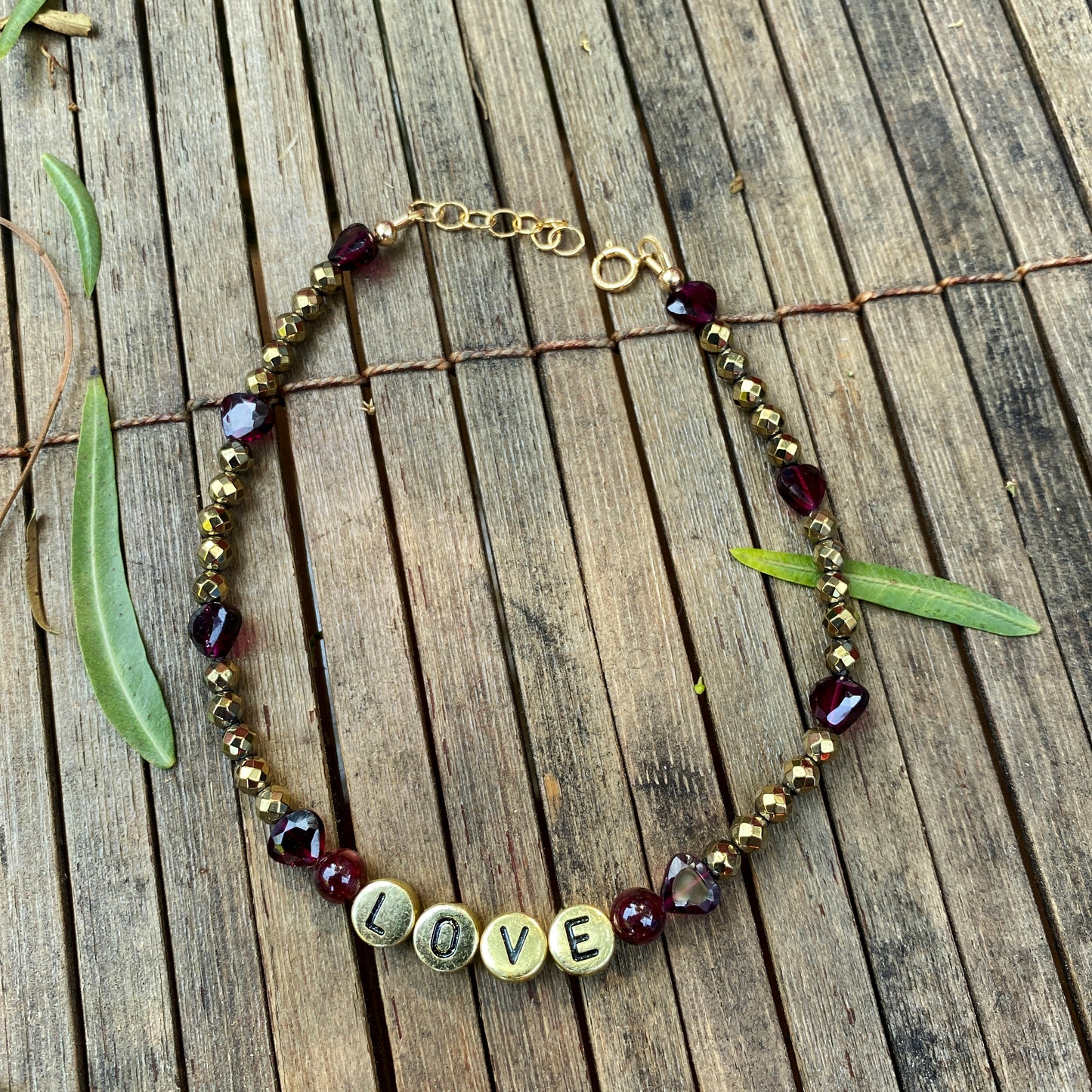 Garnet and hematite beaded gemstone “love” anklet with heart shaped garnets