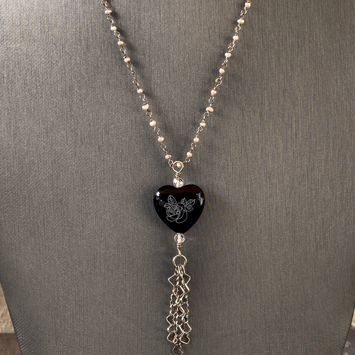 Sterling silver with freshwater pearls, painted onyx pendant, white topaz, hanging heart chain