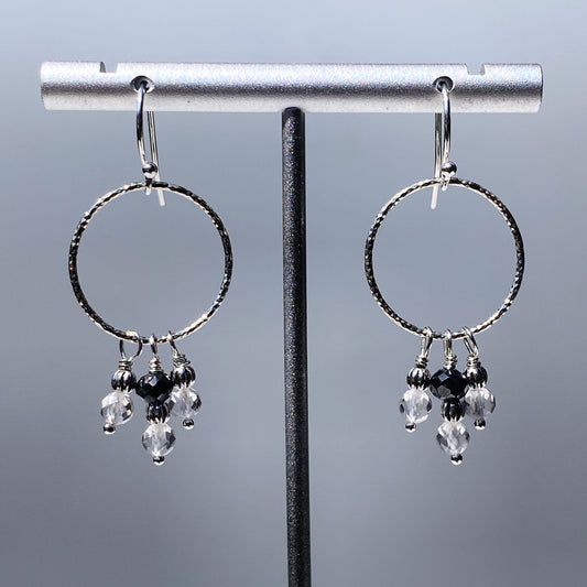 Black diamond, white topaz gemstones, and and sterling silver dangle earrings
