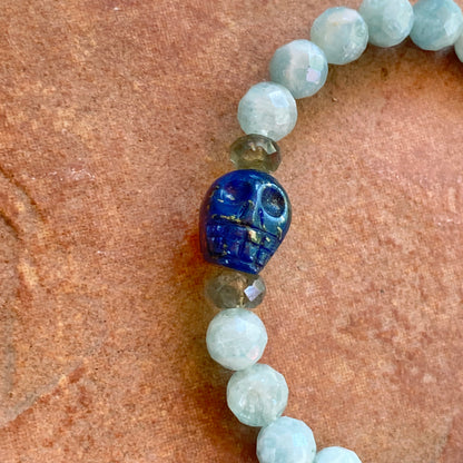 Lapis lazuli skull, pyrite, Labradorite, and blue sapphire stretch bracelet