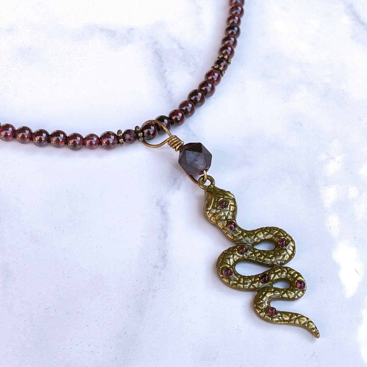 Garnet gemstone and Brass Snake pendant Necklace